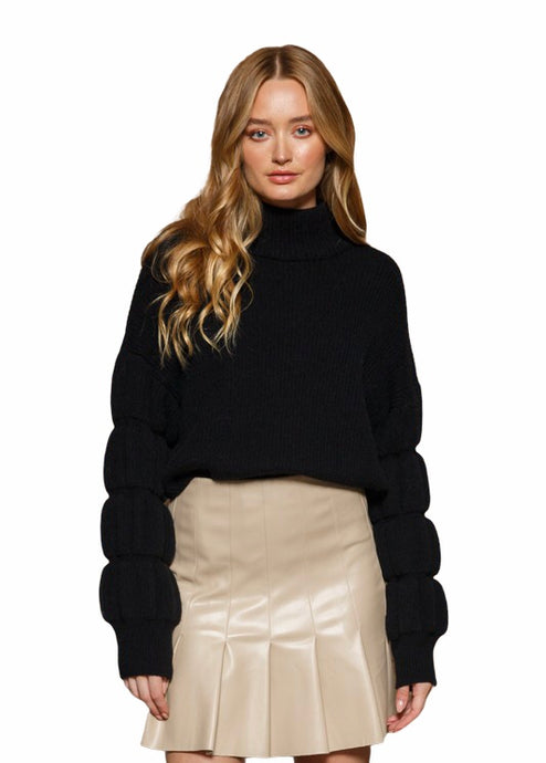 Black knit sweater, with bubble sleeve details, and mock neckline 